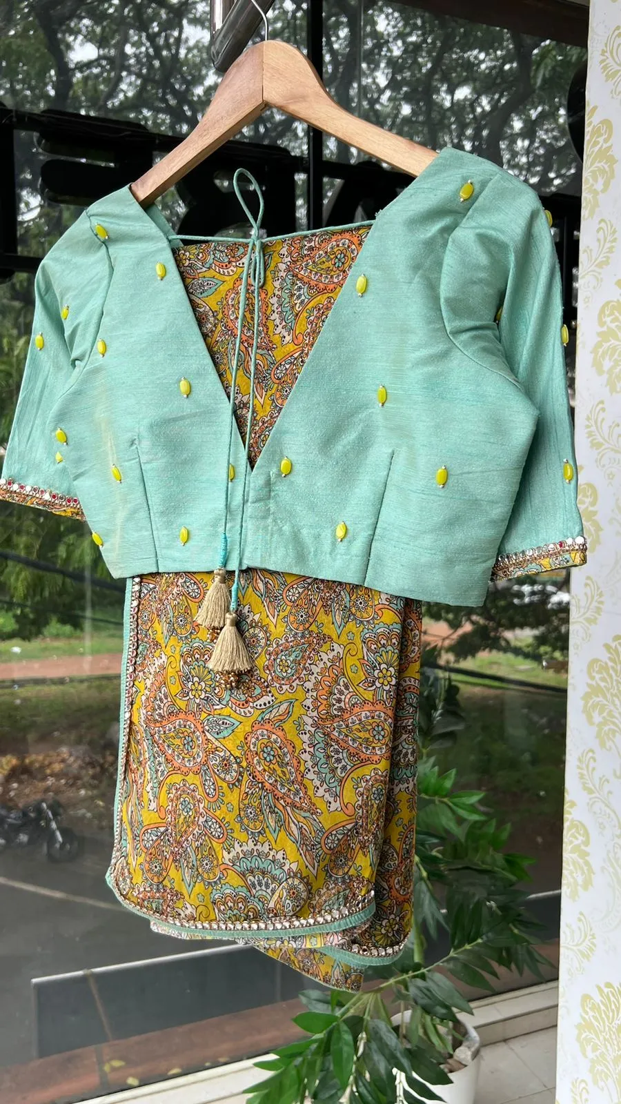 Fenugreek floral organza saree with hand worked blouse
