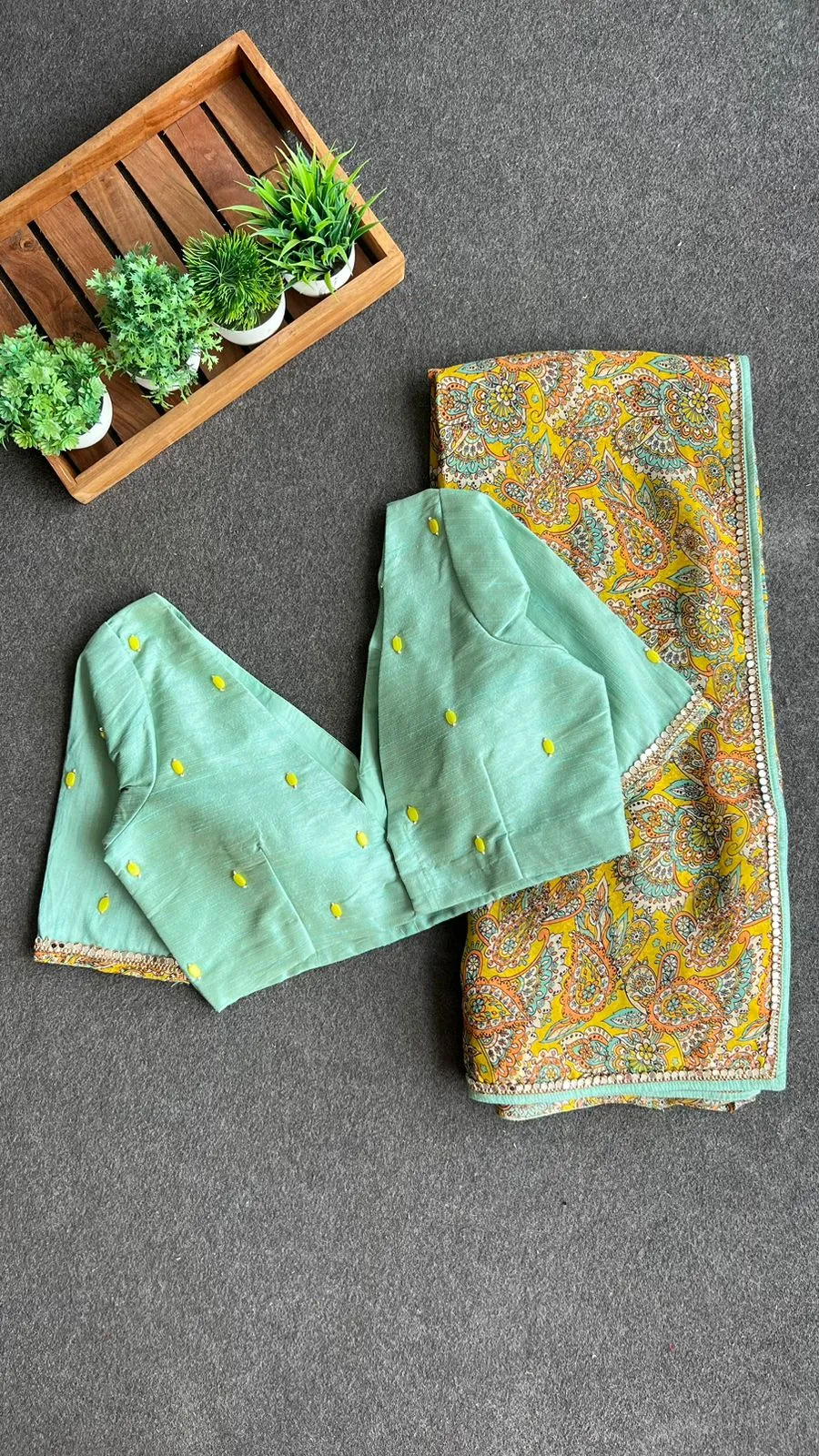 Fenugreek floral organza saree with hand worked blouse