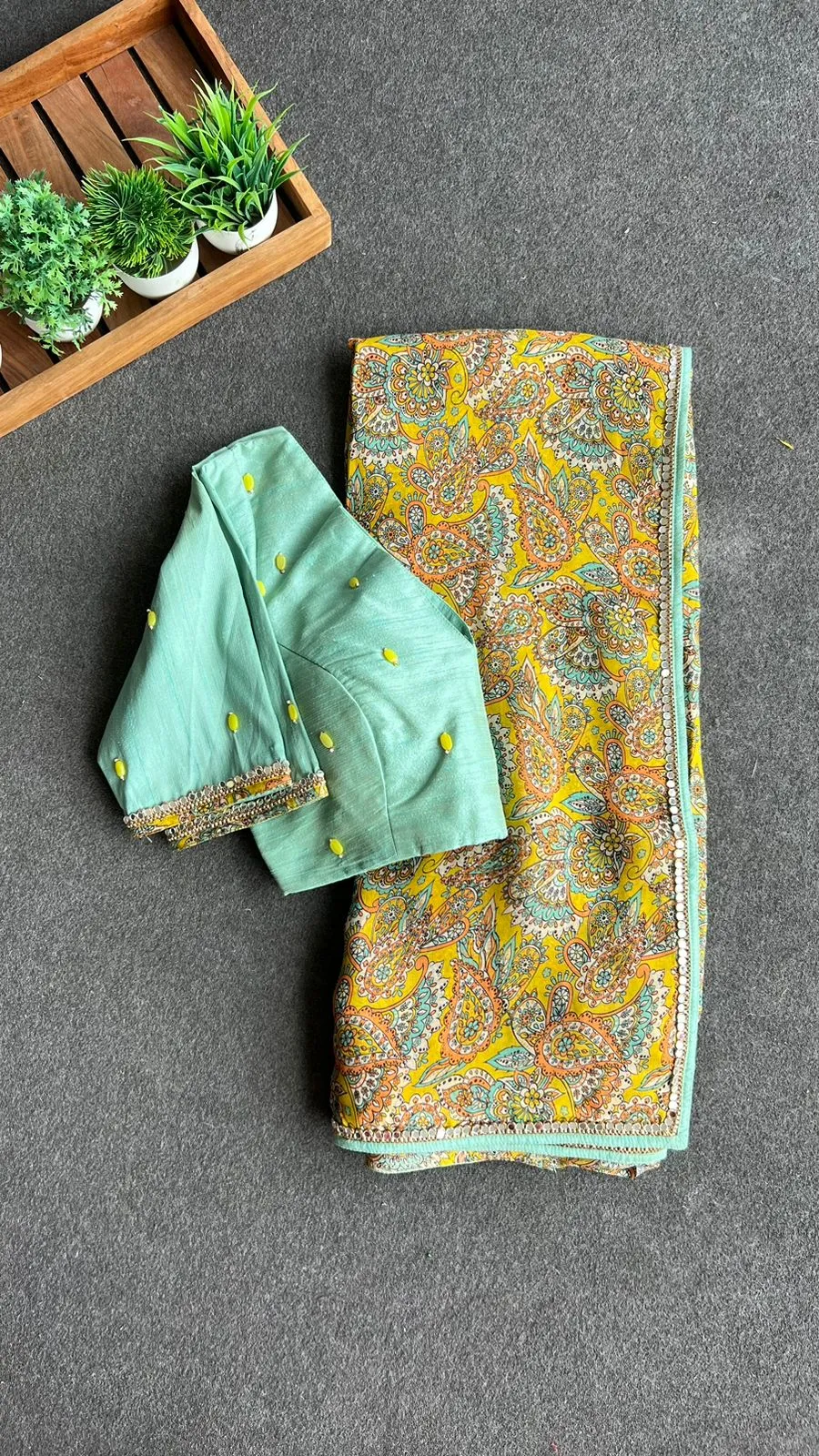 Fenugreek floral organza saree with hand worked blouse